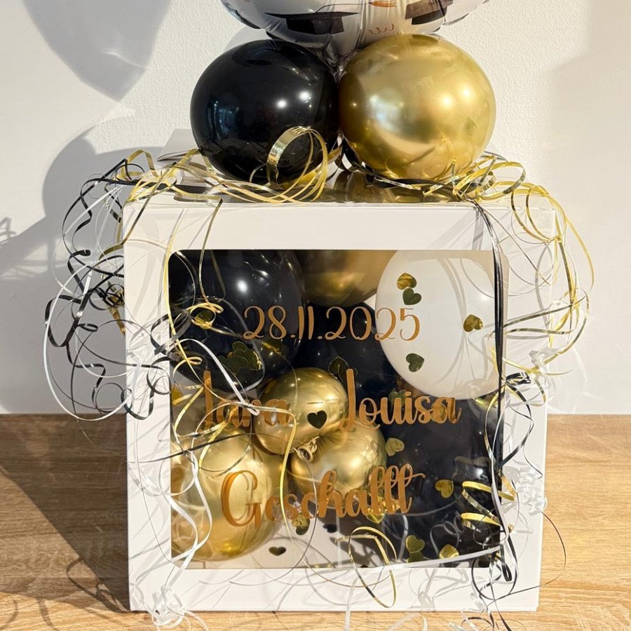 Personalisierte Ballonbox zur bestandenen Prüfung in Schwarz Gold mit YES Bestanden Ballon und Name

