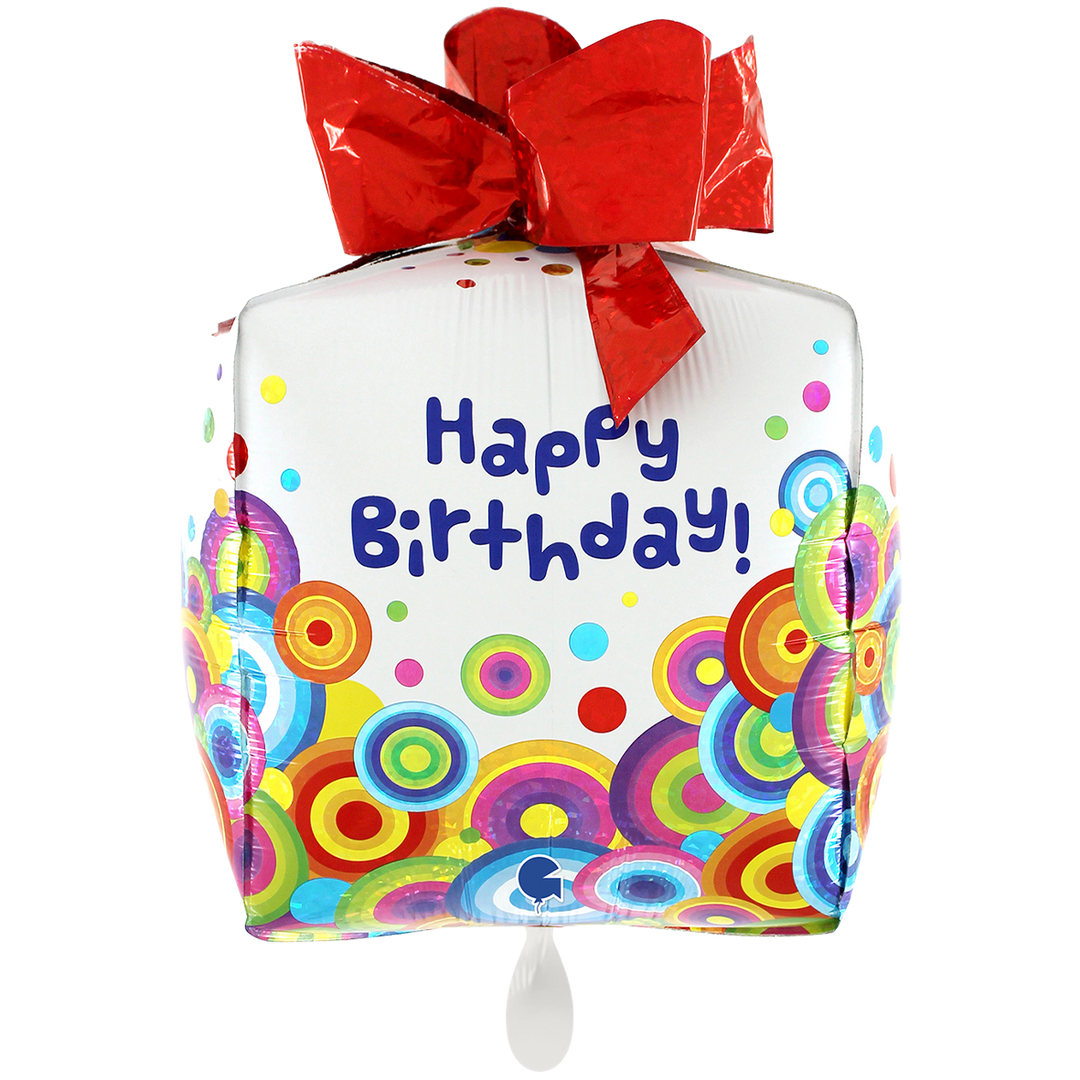 Ein bunter Ballon in Form eines Geschenkes mit roter Schleife 