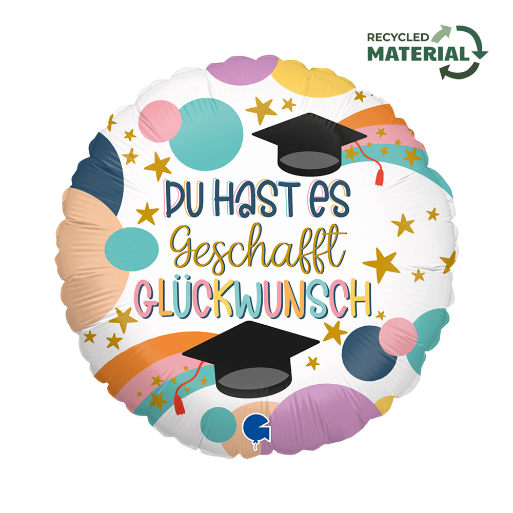 Runder Folienballon mit bunten Kreisen, Sternen, Doktorhüten und der Aufschrift „Du hast es geschafft – Glückwunsch!“.