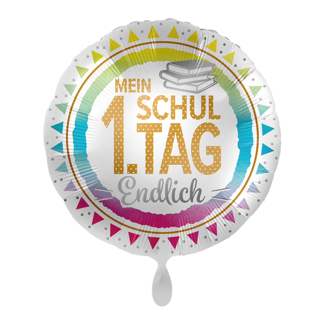 Runder Folienballon zur Einschulung mit der Aufschrift „Mein 1. Schultag Endlich“, buntem Regenbogenring und Bücher-Motiv